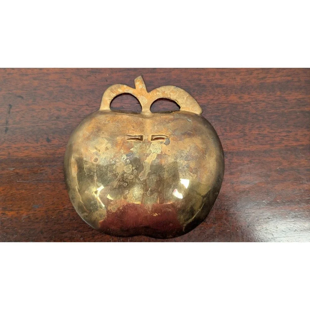 Vintage enameled brass apple-shaped trinket dish, often used for jewelry, keys